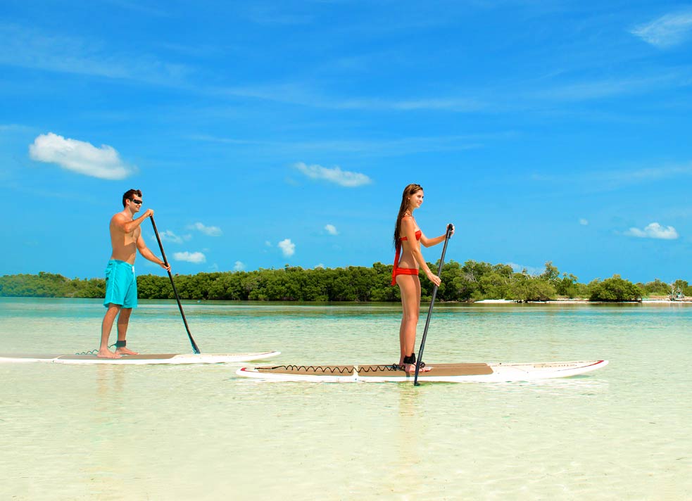 Couple paddle boarding in Key West